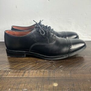 Allen Edmonds Fifth Avenue black leather cap-toe oxford dress shoes.